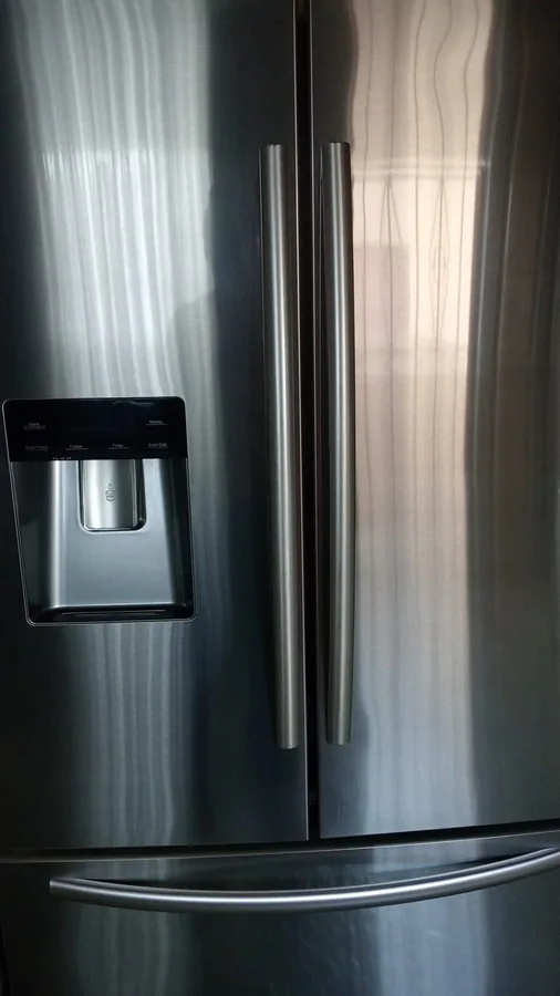 Appliance repair technician assisting a customer in Ballito