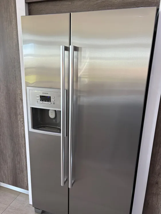 Technician providing freezer repair service in Ballito