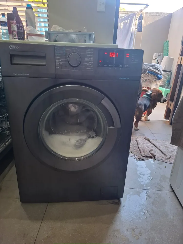 Technician providing tumble dryer repair service in Ballito