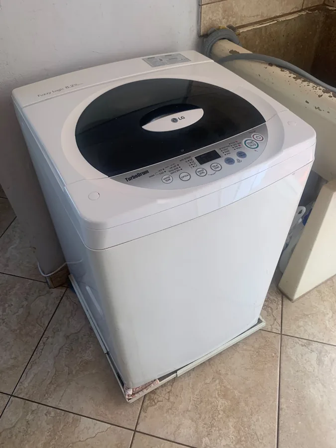 Technician providing washing machine repair service in Ballito
